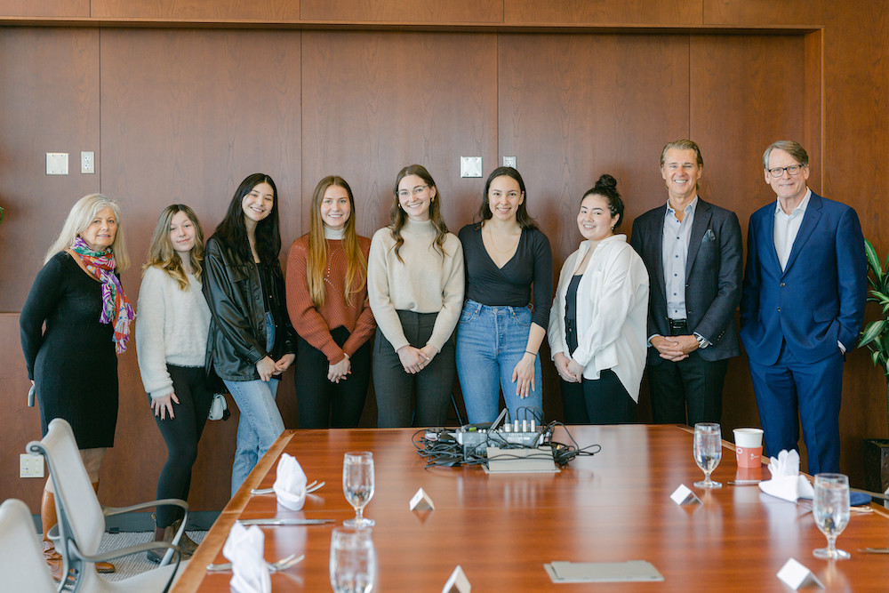 The Spitz Fellows Luncheon held on March, 30, 2022. Pictured left to right: Maureen Spitz, Lily Strength-Jarick, Annalies Verhoeff, Hannah Koroll, Emily St. Cyr, Elsa Doxtdator-Jansson, Bailey Hill, Warren Spitz, and former Dean Robert Helsley. 