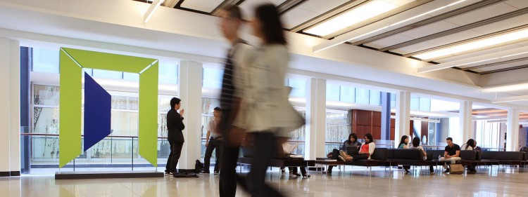 Image of people walking through Sauder main lobby