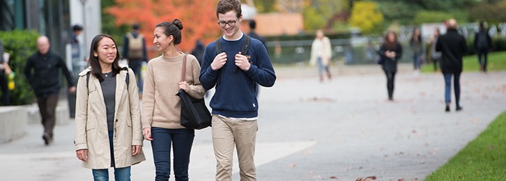 A group of students walking outside on campus