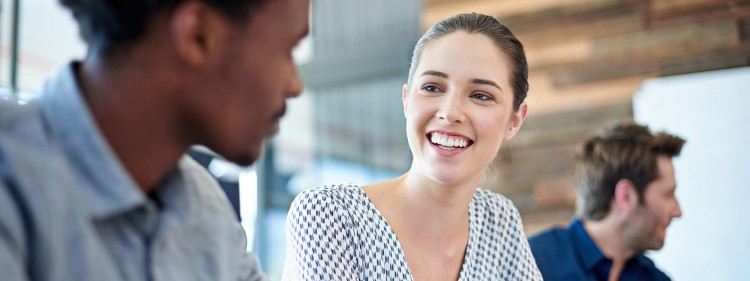 Image of two business students talking to each other