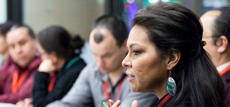 Image of female Aboriginal student talking to another student