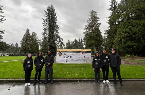 Amaan Panchbhai, Event Lead, (center-right) and the volunteering team at the B2Gold Big Brother Golf Classic